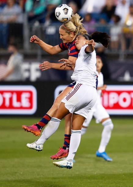 Lindsey Horan of United States wins a ball out of the air over Karina Rodriguez of Mexico at Rentschler Field on July 01, 2021 in East Hartford,...