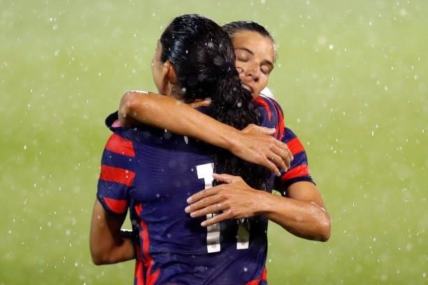 Christen Press of United States celebrates with Tobin Heath, #7 after scoring a goal against Mexico at Rentschler Field on July 01, 2021 in East...