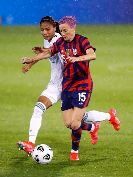 Megan Rapinoe of United States dribbles downfield past Nancy Antonio of Mexico at Rentschler Field on July 01, 2021 in East Hartford, Connecticut.