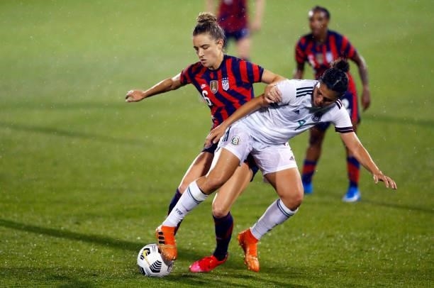 Jocelyn Orejel of Mexico shields the ball from Kristie Mewis of United States at Rentschler Field on July 01, 2021 in East Hartford, Connecticut.