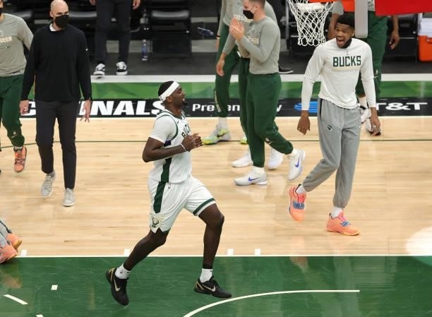 Bobby Portis of the Milwaukee Bucks celebrates as Giannis Antetokounmpo looks on during a time out against the Atlanta Hawks during the first half in...