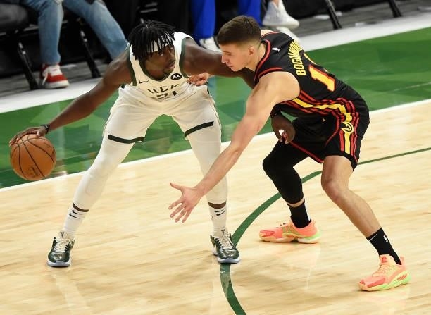 Bogdan Bogdanovic of the Atlanta Hawks pressures Jrue Holiday of the Milwaukee Bucks during the second half in Game Five of the Eastern Conference...