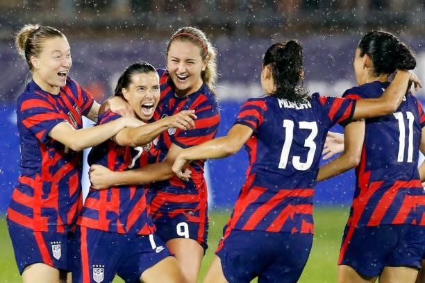 Tobin Heath of United States celebrates with Christen Press, Alex Morgan, Lindsey Horan and Emily Sonnett, #14 after scoring a goal against Mexico at...