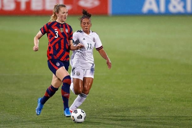 Samantha Mewis of United States dribbles downfiedl against Maria Sanchez of Mexico at Rentschler Field on July 01, 2021 in East Hartford, Connecticut.