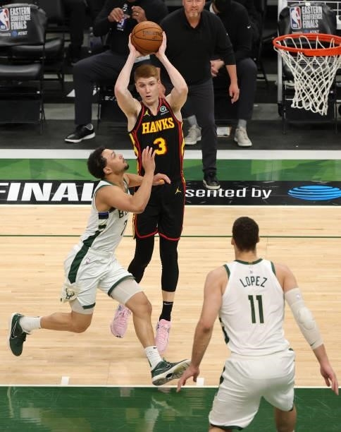 Kevin Huerter of the Atlanta Hawks is defended by Bryn Forbes of the Milwaukee Bucks during the second half in Game Five of the Eastern Conference...