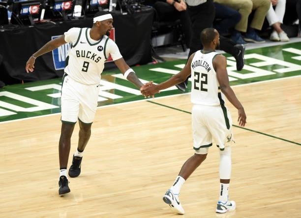 Khris Middleton and Bobby Portis of the Milwaukee Bucks celebrate against the Atlanta Hawks during the second half in Game Five of the Eastern...