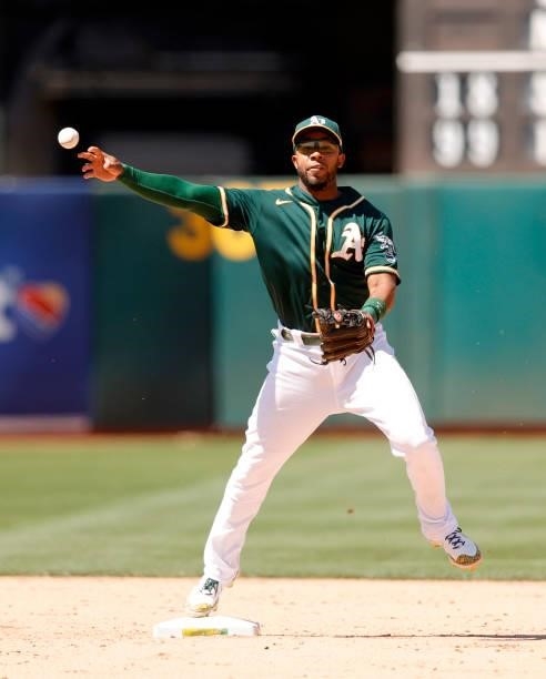 Elvis Andrus of the Oakland Athletics throws to first base against the Texas Rangers at RingCentral Coliseum on July 01, 2021 in Oakland, California.