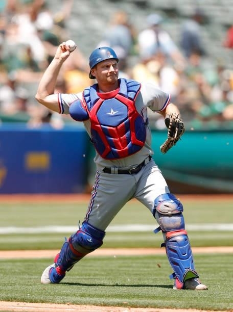 John Hicks of the Texas Rangers throws to first base against the Oakland Athletics at RingCentral Coliseum on July 01, 2021 in Oakland, California.