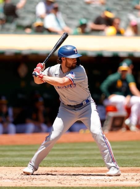 Charlie Culberson of the Texas Rangers bats against the Oakland Athletics at RingCentral Coliseum on July 01, 2021 in Oakland, California.