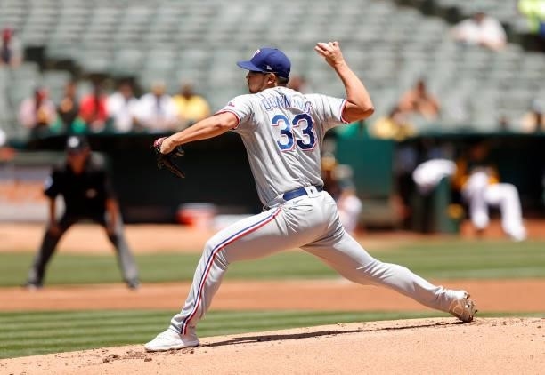 Dane Dunning of the Texas Rangers pitches against the Oakland Athletics at RingCentral Coliseum on July 01, 2021 in Oakland, California.