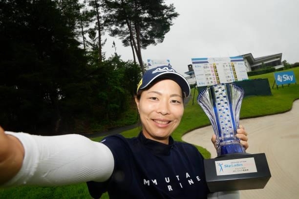 Mayu Hattori of Japan imitates the selfie after winning the final round of the Sky Ladies ABC Cup at the ABC Golf Club on July 02, 2021 in Kato,...