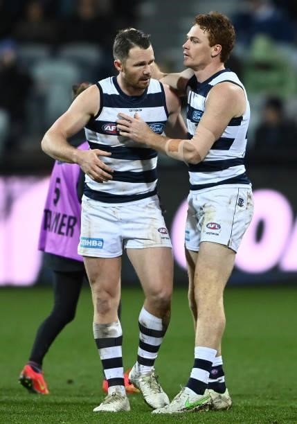 Patrick Dangerfield of the Cats is congratulated by Gary Rohan after kicking a goal during the round 16 AFL match between Geelong Cats and Essendon...