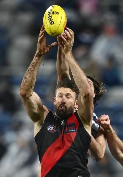 Cale Hooker of the Bombers attempts to mark during the round 16 AFL match between Geelong Cats and Essendon Bombers at GMHBA Stadium on July 02, 2021...