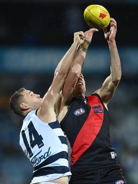 Jordan Ridley of the Bombers marks infront of Joel Selwood of the Cats during the round 16 AFL match between Geelong Cats and Essendon Bombers at...
