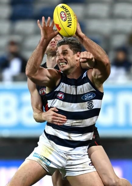 Tom Hawkins of the Cats marks infront of Jayden Laverde of the Bombers during the round 16 AFL match between Geelong Cats and Essendon Bombers at...