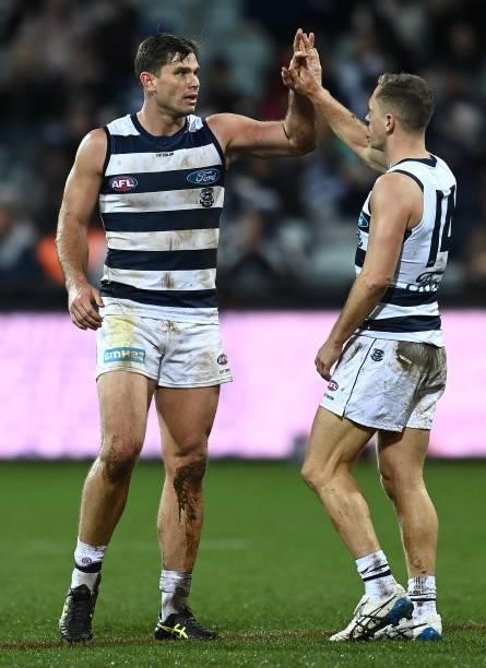 Tom Hawkins of the Cats is congratulated by Joel Selwood after kicking a goal during the round 16 AFL match between Geelong Cats and Essendon Bombers...