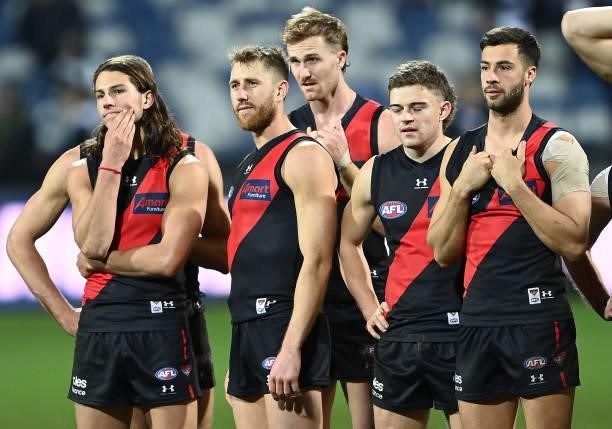 The Bombers look dejected after losing the round 16 AFL match between Geelong Cats and Essendon Bombers at GMHBA Stadium on July 02, 2021 in Geelong,...