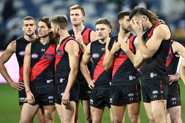 The Bombers look dejected after losing the round 16 AFL match between Geelong Cats and Essendon Bombers at GMHBA Stadium on July 02, 2021 in Geelong,...