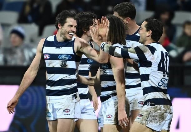 Isaac Smith of the Cats is congratulated by team mates after kicking a goal during the round 16 AFL match between Geelong Cats and Essendon Bombers...