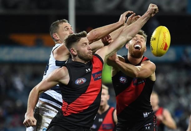 Jayden Laverde of the Bombers spoils a mark by Joel Selwood of the Cats during the round 16 AFL match between Geelong Cats and Essendon Bombers at...