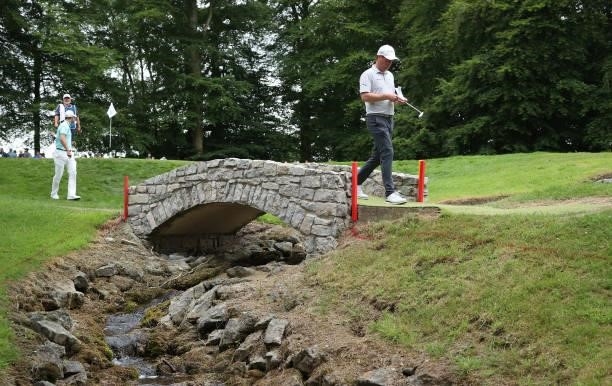 Jonathan Caldwell of Northern Ireland crosses a bridge on the 13th hole during Day Two of The Dubai Duty Free Irish Open at Mount Juliet Golf Club on...
