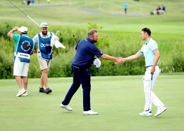 Shane Lowry of Ireland and Martin Kaymer of Germany shake hands on the 18th green during Day Two of The Dubai Duty Free Irish Open at Mount Juliet...