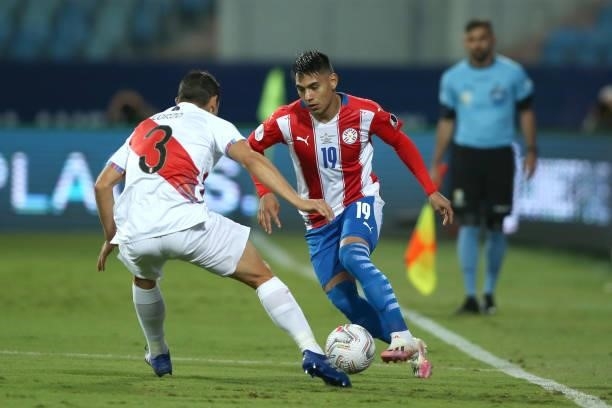 Santiago Arzamendia of Paraguay fights for the ball with Aldo Corzo of Peru during a quarterfinal match between Peru and Paraguay as part of Copa...