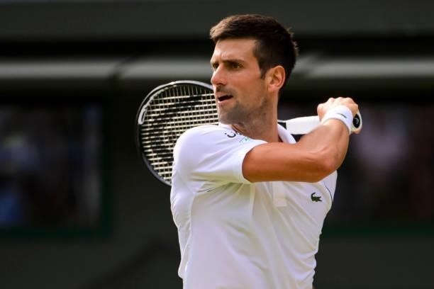 Novak Djokovic of Serbia hits a forehand against Denis Kudla of the United States in the third round of the gentlemen's singles during Day Five of...