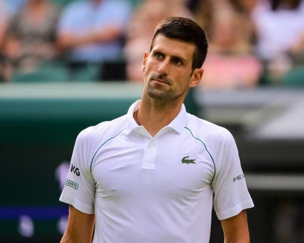 Novak Djokovic of Serbia looks to his team during his match against Denis Kudla of the United States in the third round of the gentlemen's singles...