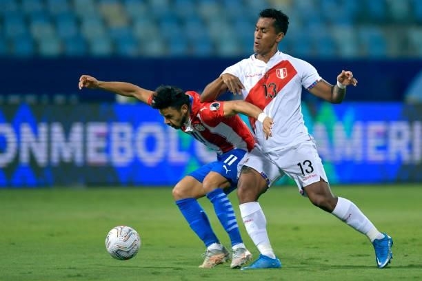 Angel Romero of Paraguay fights for the ball with Renato Tapia of Peru during a quarterfinal match between Peru and Paraguay as part of Copa America...
