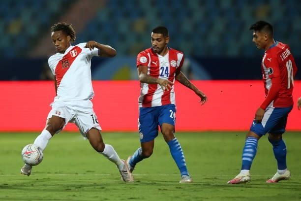 André Carrillo of Peru controls the ball against Hector Martinez of Paraguay during a quarterfinal match between Peru and Paraguay as part of Copa...
