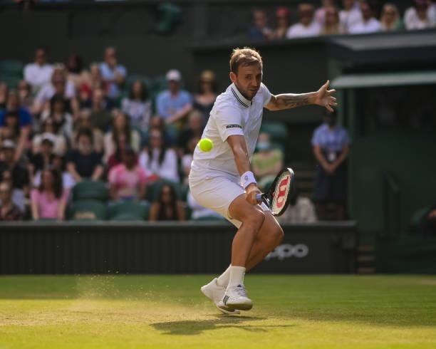 Dan Evans of Great Britain hits a backhand against Sebastian Korda of the United States in the third round of the gentlemen's singles during Day Five...