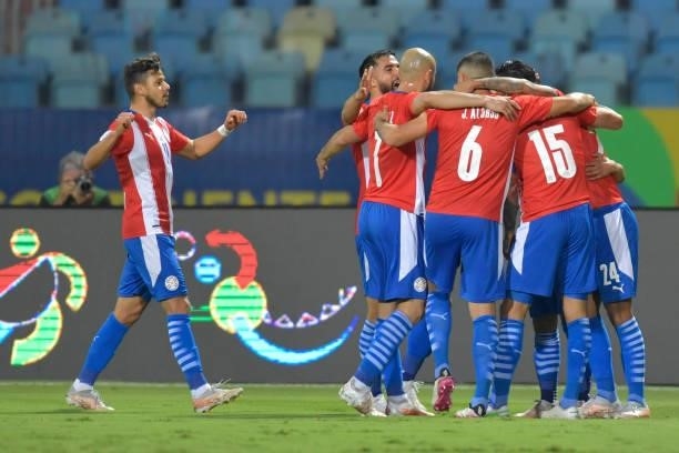 Gustavo Gomez of Paraguay celebrates with teammates after scoring the first goal of his team during a quarterfinal match between Peru and Paraguay as...