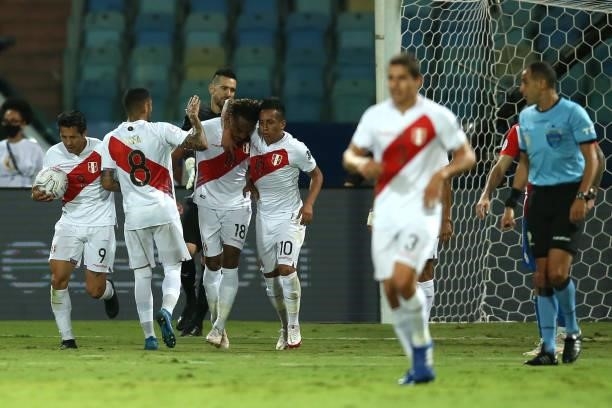 Gianluca Lapadula of Peru celebrates with teammates after scoring the first goal of his team during a quarterfinal match between Peru and Paraguay as...