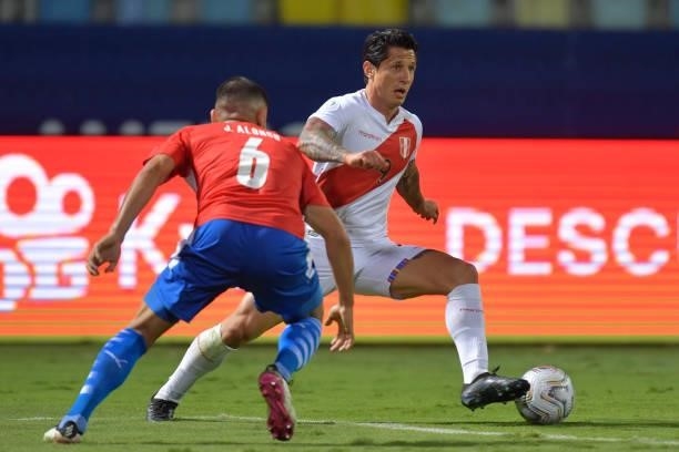 Gianluca Lapadula of Peru controls the ball against Junior Alonso of Paraguay during a quarterfinal match between Peru and Paraguay as part of Copa...