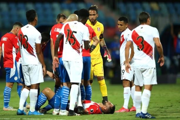 Alberto Espinola of Paraguay lays on the pitch after suffering an injury during a quarterfinal match between Peru and Paraguay as part of Copa...