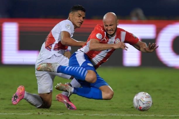 Carlos Gonzalez of Paraguay fights for the ball with Ánderson Santamaría of Peru during a quarterfinal match between Peru and Paraguay as part of...