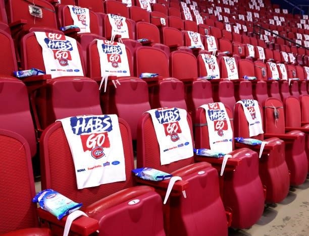 Seats at the arena are adorned with rally towels and hand sanitizer wipes prior to Game Three of the 2021 NHL Stanley Cup Final between the Montreal...