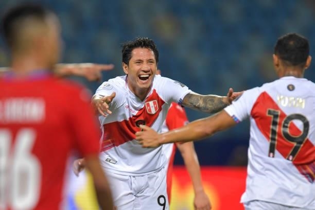 Gianluca Lapadula of Peru celebrates with teammates after scoring the second goal of his team during a quarterfinal match between Peru and Paraguay...
