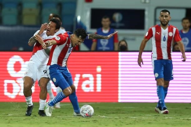 Gustavo Gomez of Paraguay fights for the ball with Gianluca Lapadula of Peru during a quarterfinal match between Peru and Paraguay as part of Copa...