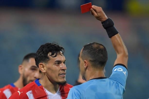 Referee Esteban Ostojich shows a red card to Gustavo Gomez of Paraguay during a quarterfinal match between Peru and Paraguay as part of Copa America...
