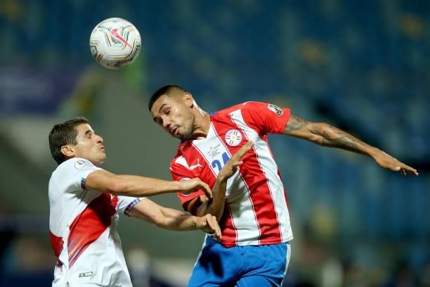 Hector Martinez of Paraguay heads the ball during a quarterfinal match between Peru and Paraguay as part of Copa America Brazil 2021 at Estadio...