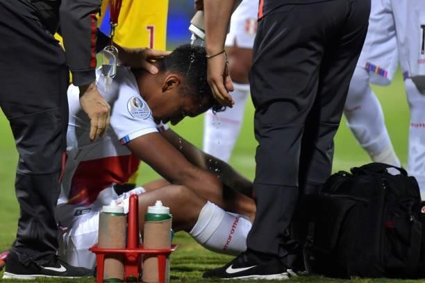 Renato Tapia of Peru receives medical attention after suffering an injury during a quarterfinal match between Peru and Paraguay as part of Copa...