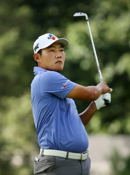 Sung Kang of South Korea plays his shot from the ninth tee during the second round of the Rocket Mortgage Classic on July 02, 2021 at the Detroit...
