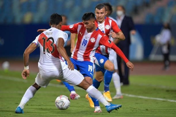Santiago Arzamendia of Paraguay fights for the ball with Renato Tapia of Peru during a quarterfinal match between Peru and Paraguay as part of Copa...