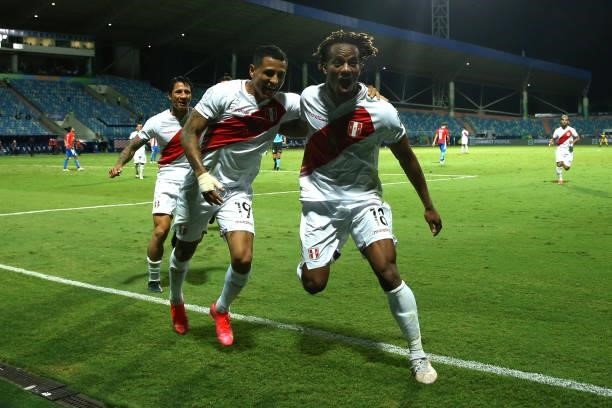 Yoshimar Yotún of Peru celebrates with teammate André Carrillo after scoring the third goal of his team during a quarterfinal match between Peru and...