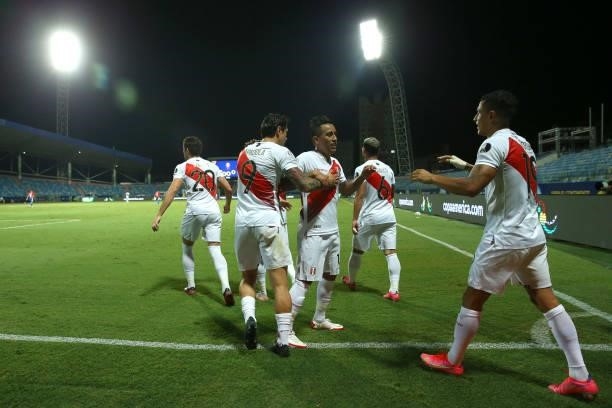 Yoshimar Yotún of Peru celebrates with teammates after scoring the third goal of his team during a quarterfinal match between Peru and Paraguay as...