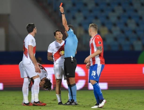 Referee Esteban Ostojich shows a red card to André Carrillo of Peru during a quarterfinal match between Peru and Paraguay as part of Copa America...