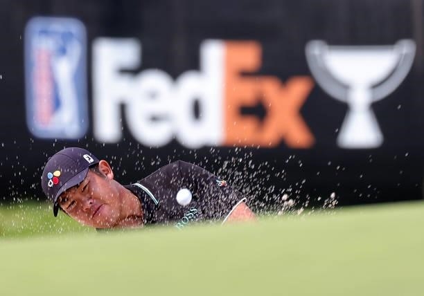 Byeong-hun An of South Korea plays a shot from a bunker on the eighth hole during the second round of the Rocket Mortgage Classic on July 02, 2021 at...