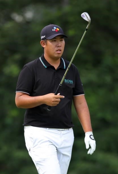 Byeong-hun An of South Korea prepares to putt on the eighth green during the second round of the Rocket Mortgage Classic on July 02, 2021 at the...